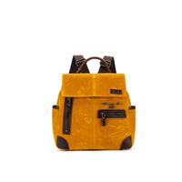 della Q Maker's Midi Backpack in the color Mustard