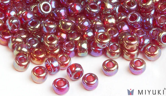 Miyuki 6/0 glass seed beads in the color 298 Transparent Ruby AB