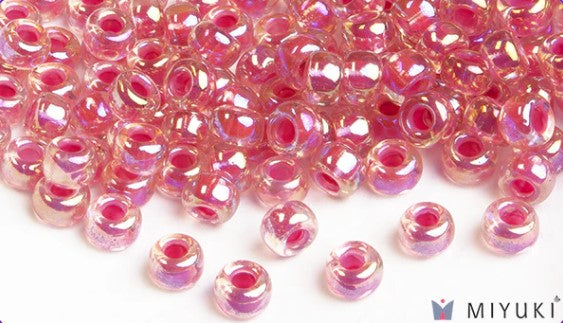 Miyuki 6/0 glass seed beads in the color 355 Magenta-lined crystal ab