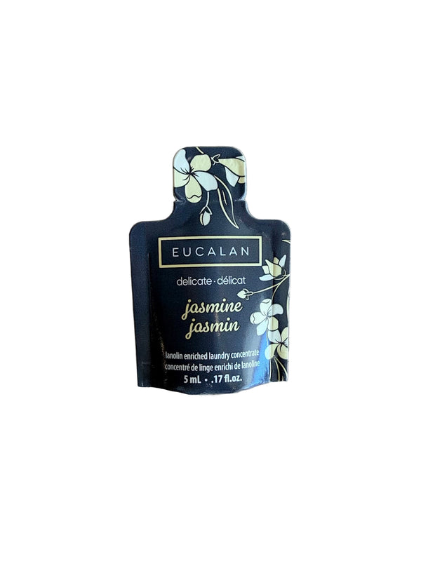 Eucalan jasmine sample packet on a wooden surface