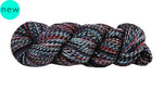 Manos Del Uruguay Marla Yarn in the color Liquorice (black, navy, red, pink, white)