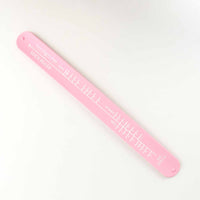 Pink colored sock sizing ruler 