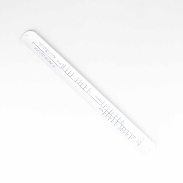 White colored sock sizing ruler 