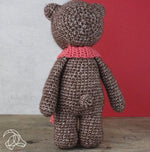 crocheted bear toy back view