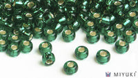 Miyuki 6/0 glass seed beads in the color 17 Siverlined EmeraldMiyuki 6/0 glass seed beads in the color 17 Silverlined Emerald