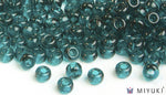 Miyuki 6/0 glass seed beads in the color 2406 Transparent Dark Teal
