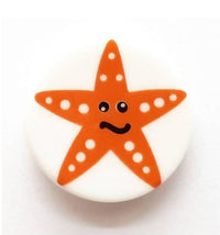 14mm white button with orange starfish on it