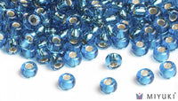 Miyuki 6/0 glass seed beads in the color 25 Silverlined Capri Blue