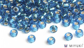 Miyuki 6/0 glass seed beads in the color 25 Silverlined Capri Blue