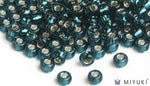 Miyuki 6/0 glass seed beads in the color 30 Silverlined Dark TealMiyuki 6/0 glass seed beads in the color 30 Silverlined Dark Teal