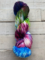 Knitted Wit hand dyed Sock yarn in the color Wrangell St. Elias (multi colored with blue, magenta, green, purple)