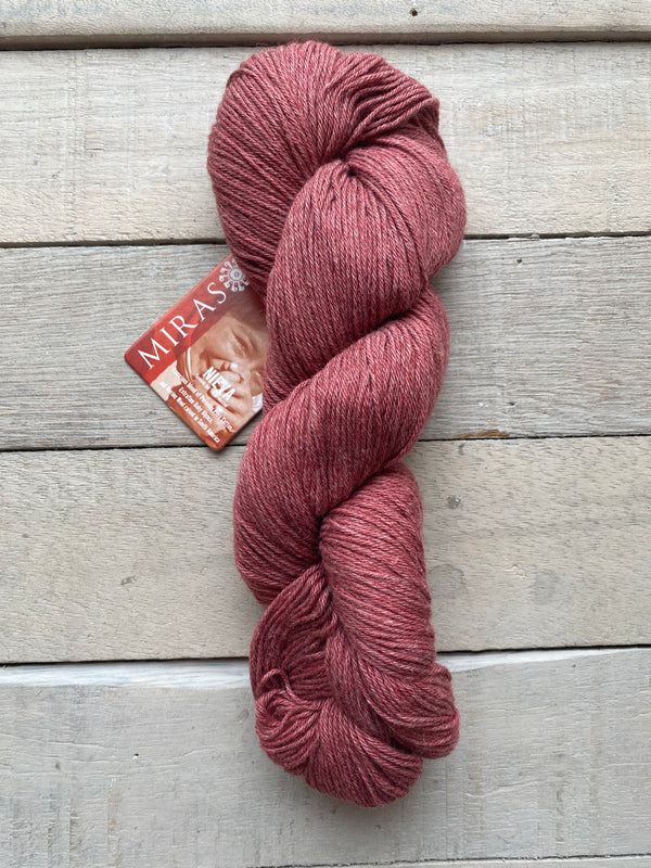 Mirasol Nieva yarn in the color Pomegranate 06