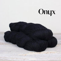 The Fibre Co. Road to China Light yarn in the color onyx (black)