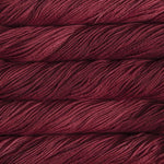 Malabrigo Arroyo yarn in the color Ravelry Red